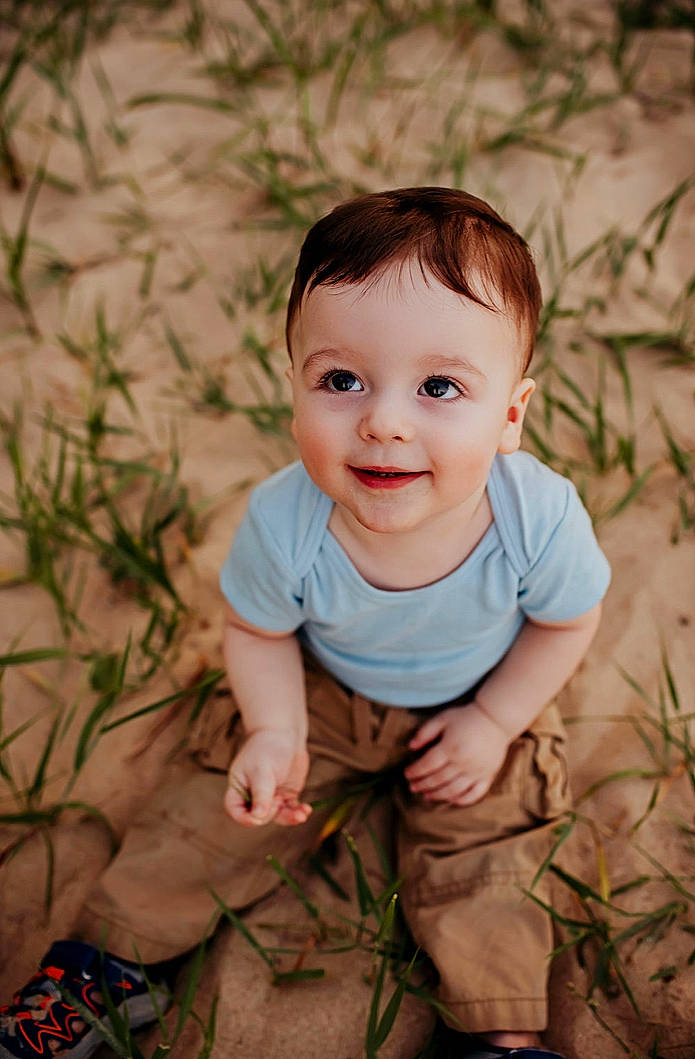 Emilio joined the competition — help win amazing prizes! baby, baby_toddler_clothing, cheek, eye, face, facial_expression, flash_photography, grass, happy, head, iris, joy, nose, people_in_nature, person, plant, skin, sleeve, smile, toddler
