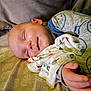 Josiah joined the competition — help win amazing prizes! baby, sleeping, pajamas, bed, blanket, smile, face, hand, infant, cozy, child, cute, rest, peaceful, indoors, soft_light, pattern, comfort, young, portrait