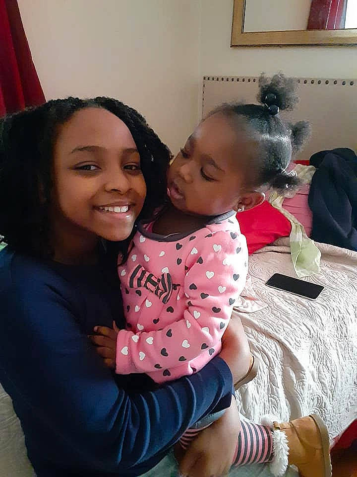 Tyia joined the competition — help win amazing prizes! black_hair, cheek, child, fun, happy, joy, person, pink, sitting, skin, smile, toddler