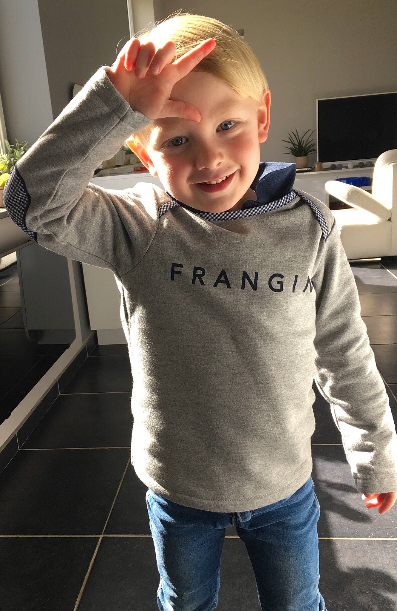 Henri a rejoint le concours — aidez-le/la à gagner de superbes lots ! blond, cheek, child, child_model, cool, fun, hairstyle, hoodie, jacket, jeans, joy, male, neck, outerwear, person, shoulder, sleeve, smile, standing, t_shirt