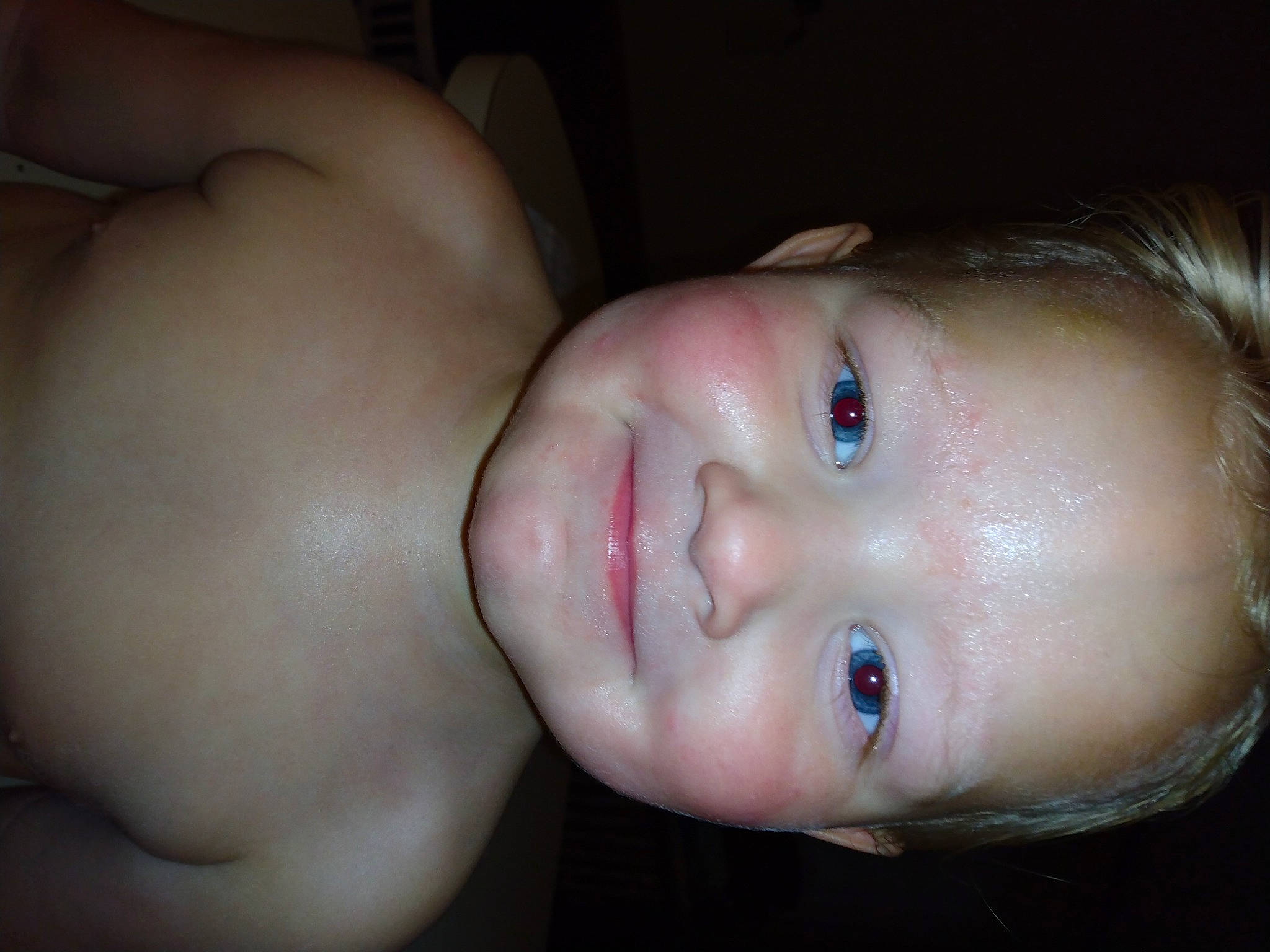 Travis is registered to the contest to win money with this photo: arm, baby, baby_toddler_clothing, cheek, chest, ear, eyebrow, eyelash, flash_photography, forehead, human_body, iris, jaw, joy, lip, mouth, neck, nose, person, smile