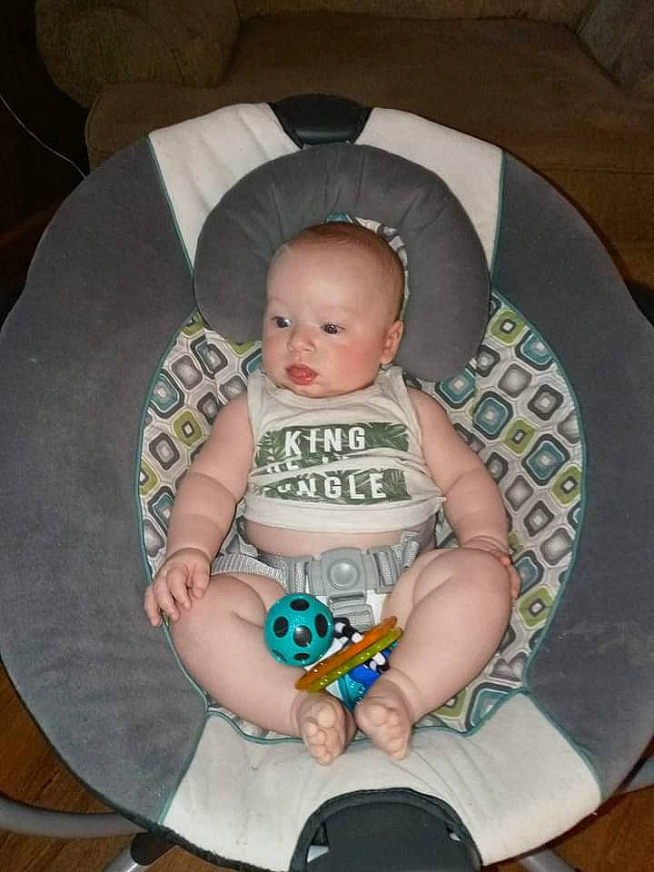 Braidyn joined the competition — help win amazing prizes! baby, baby_carriage, baby_products, baby_toddler_clothing, bib, chair, cheek, child, circle, comfort, foot, lap, linens, person, sitting, sleeve, smile, sock, thigh, toddler