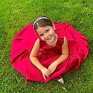 Paloma participe au concours pour gagner de l'argent avec cette photo : child, girl, smiling, red_dress, headband, grass, outdoor, nature, happy, portrait, sitting, cute, young, fashion, person, greenery, summer, joy, beauty, childhood