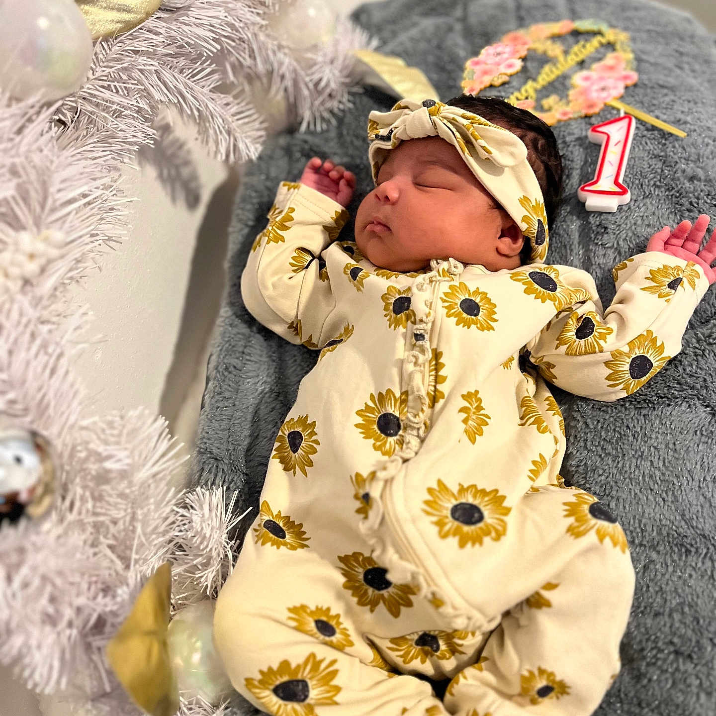 Ibeisy joined the competition — help win amazing prizes! baby, birthday_candle, blanket, celebration, christmas_tree, congratulations, cute, gold_ribbon, headband, holiday_decor, indoor, infant, number_one, onesie, ornaments, portrait, silver_balls, sleeping, soft_texture, sunflower_pattern