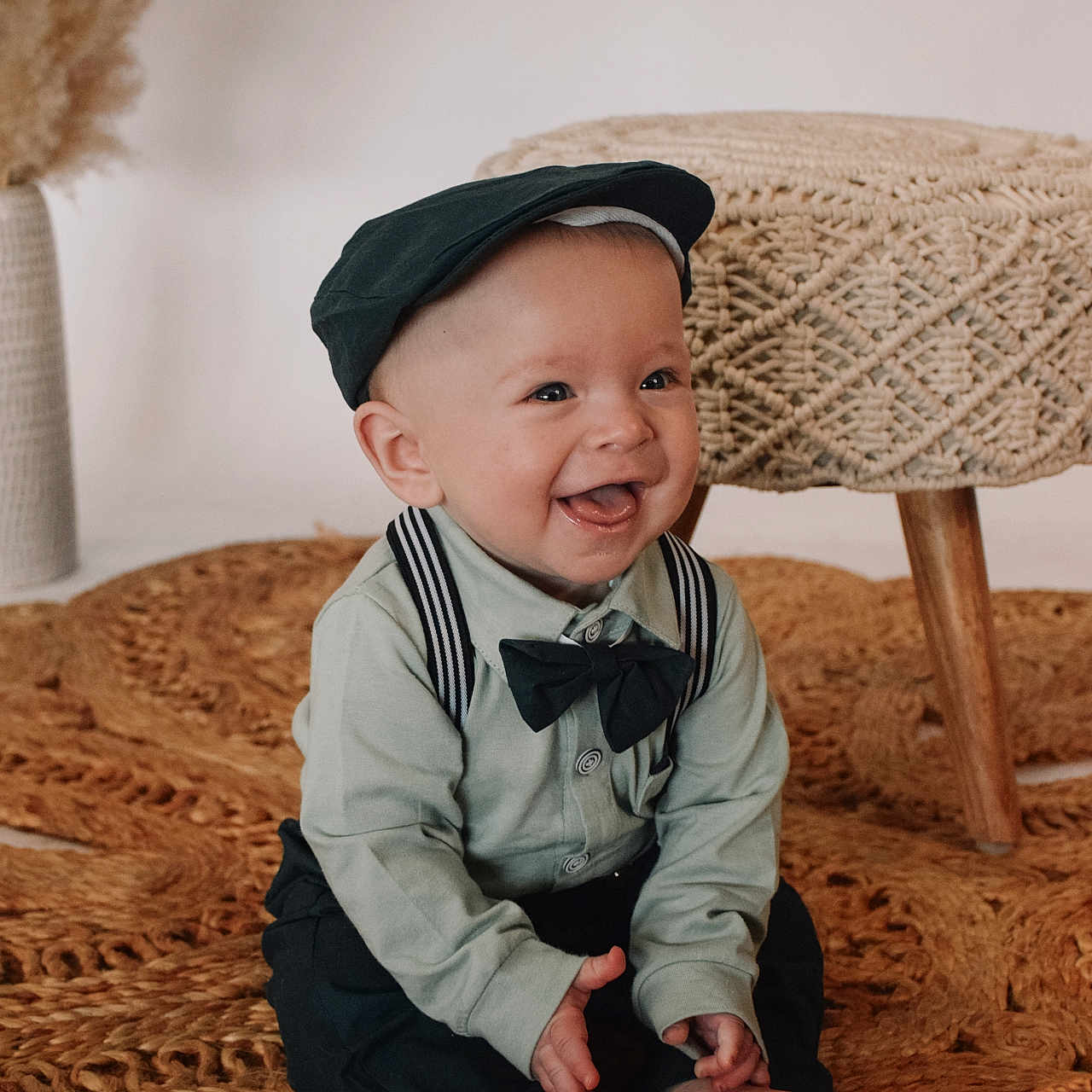Carter joined the competition — help win amazing prizes! accessories, baby, babylaughing, bodypart, cap, clothing, face, finger, formalwear, hand, happy, hat, head, pants, person, photography, portrait, sitting, smile, tie