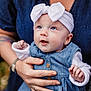 accessories, baby, bodypart, clothing, face, finger, hand, happy, hat, head, jeans, jewelry, necklace, newborn, pants, people, person, photography, portrait, smile