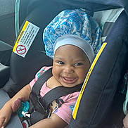 Gracelynn joined the competition — help win amazing prizes! baby, car_seat, smile, bonnet, pacifier, child, pink_shirt, safety_harness, infant, happy, cute, indoor, seatbelt, portrait, child_in_car_seat, clothing, face, person, seat, car_interior