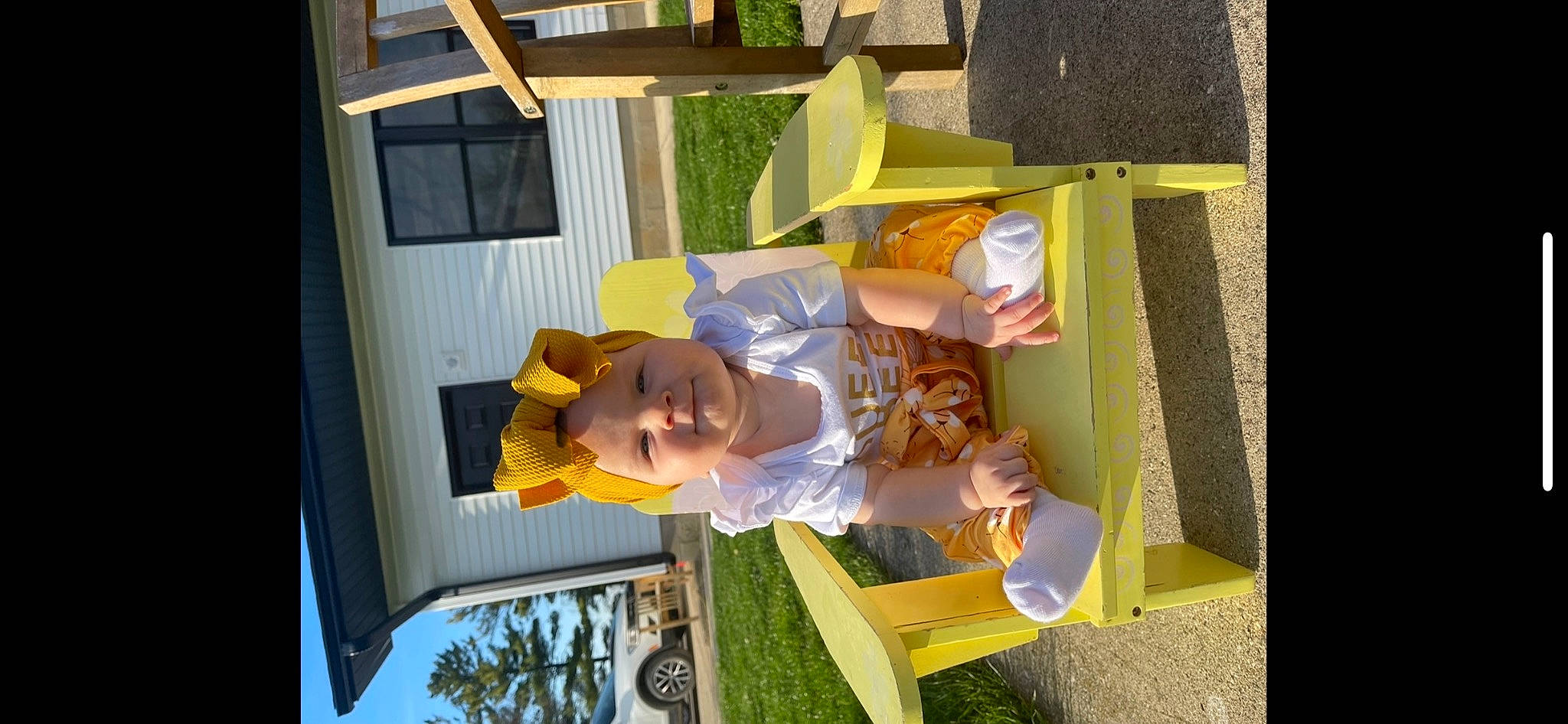 Yvette joined the competition — help win amazing prizes! art, baby, baby_products, chair, child, fun, grass, hat, headwear, house, leisure, person, plant, play, room, sun_hat, toddler, visual_arts, window, world