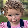 Nova joined the competition — help win amazing prizes! child, toddler, curly_hair, portrait, outdoor, green_background, pink_shirt, denim_overalls, face, eyes, expression, person, cute, young_child, closeup, innocence, nature, soft_focus, smile, baby