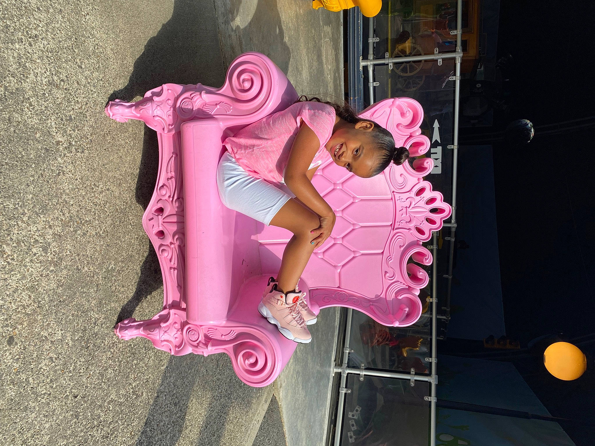 Serenity is registered to the contest to win money with this photo: art, baby_toddler_clothing, entertainment, event, font, fun, graphics, happy, joy, leisure, magenta, person, pink, recreation, sandal, tire, toddler, visual_arts, wheel