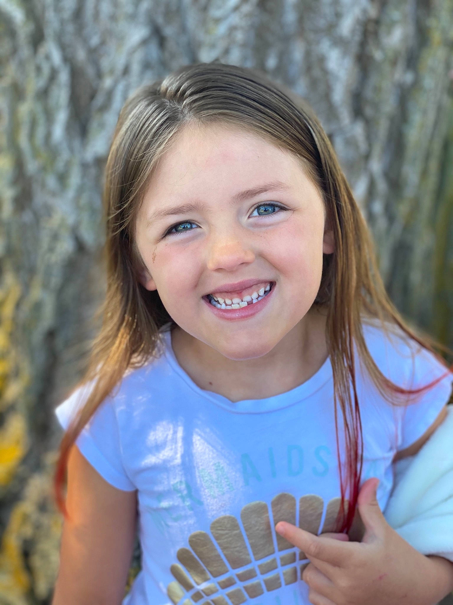 Marley is registered to the contest to win money with this photo: arm, azure, chin, eye, face, facial_expression, flash_photography, fun, gesture, grass, hairstyle, hand, happy, iris, joy, lip, organ, people_in_nature, person, shoulder