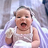 Amaya is registered to the contest to win money with this photo: baby, infant, smiling, happy, headband, bow, mittens, clothing, purple, blanket, sitting, cute, portrait, face, child, young, indoors, soft, closeup, expression