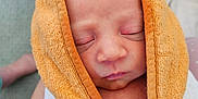 William joined the competition — help win amazing prizes! baby, sleeping, towel, orange, white, closeup, wrapped, infant, skin, face, peaceful, cozy, tattoo, leg, carpet, indoor, cute, newborn, person, portrait