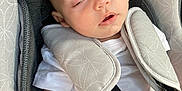 Stefan joined the competition — help win amazing prizes! baby, sleeping, car_seat, safety_harness, white_clothing, infant, padded, seat, child, resting, peaceful, closeup, indoors, comfort, head_support, straps, young_child, cushion, face, nap