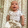 baby, infant, polka_dot, changing_mat, clothing, pants, shirt, bear_pattern, lying_down, cute, child, expression, looking_up, indoors, soft_toys_pattern, white_background, baby_clothes, small_child, happy, portrait