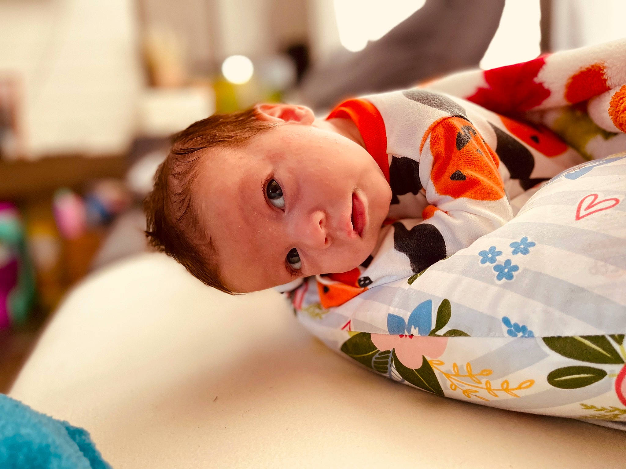 Kora is registered to the contest to win money with this photo: baby, baby_products, baby_toddler_clothing, carmine, child, comfort, event, eye, fun, happy, leisure, linens, person, room, sitting, sleeve, toddler