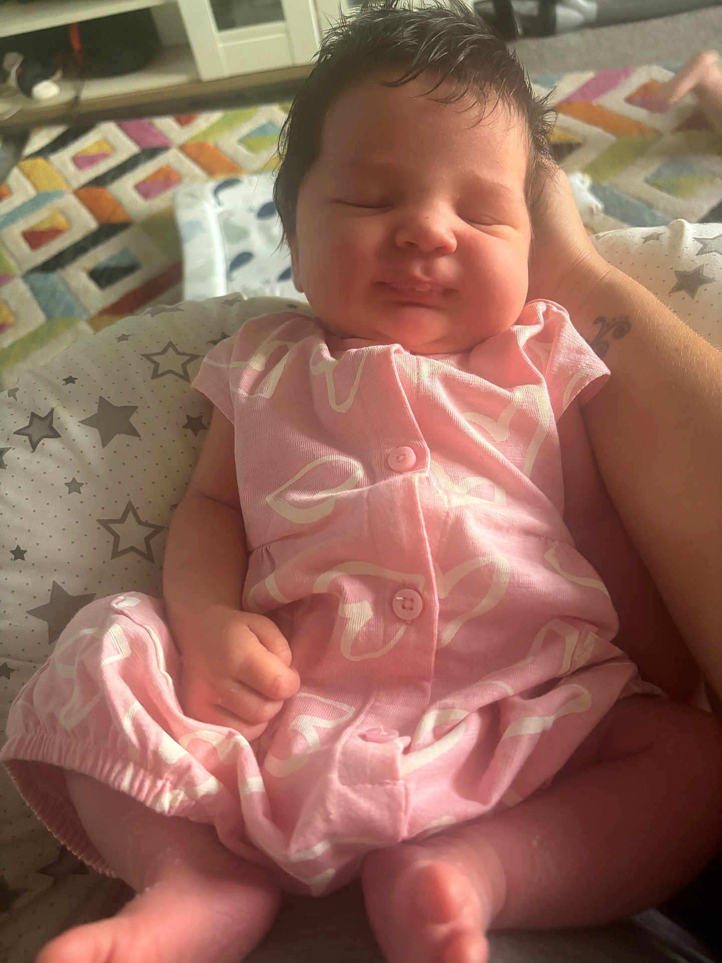 Callie joined the competition — help win amazing prizes! baby, carpet, child, closeup, cushion, cute, geometric_pattern, hand, indoor, infant, newborn, peaceful, person, pink_outfit, portrait, rest, sleeping, soft_lighting, star_pattern, tattoo