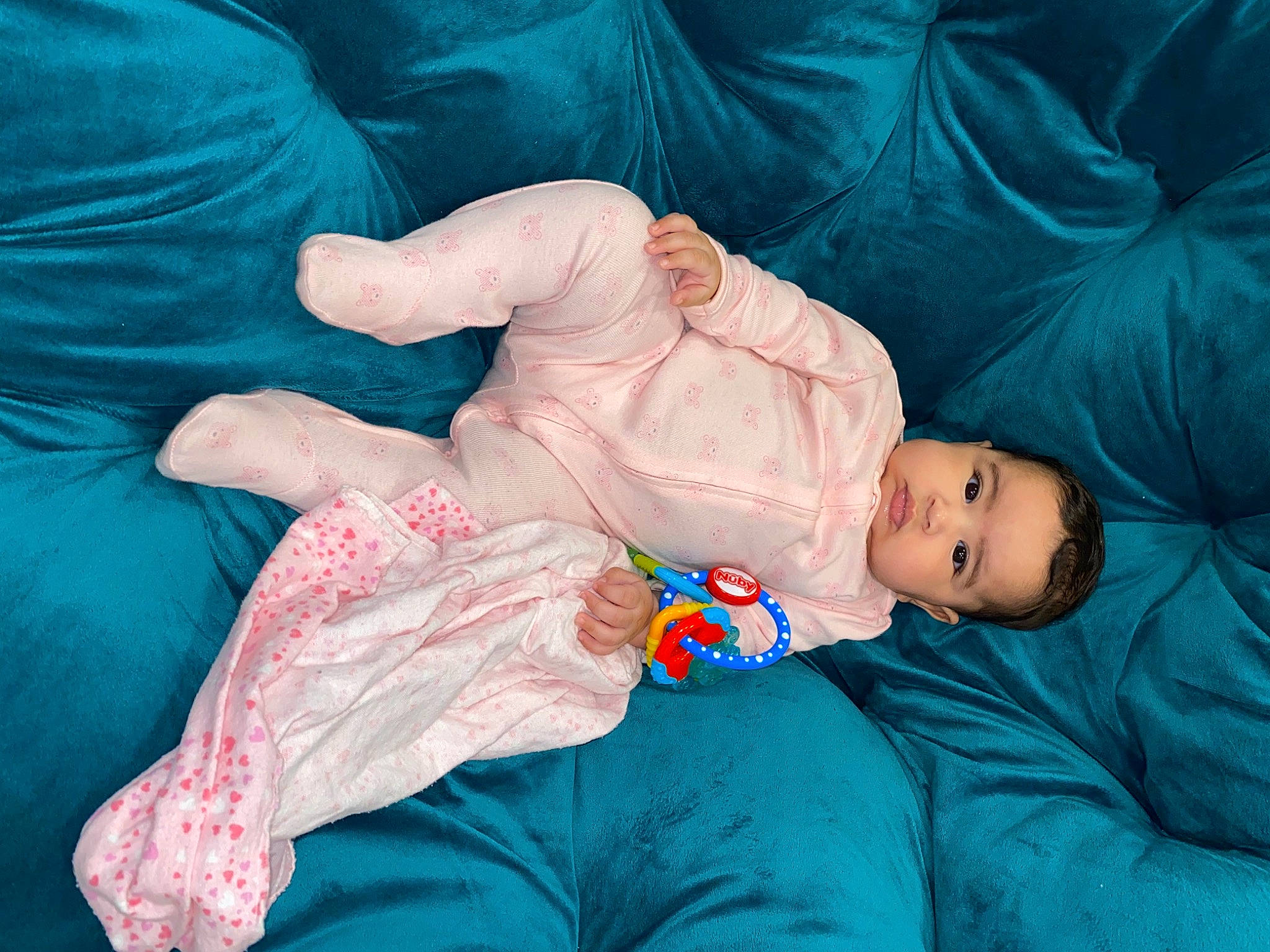 Brélyn is registered to the contest to win money with this photo: arm, azure, baby, baby_toddler_clothing, blue, comfort, eye, finger, hand, hat, head, human_body, joint, linens, orange, person, pink, skin, sleeve, toddler