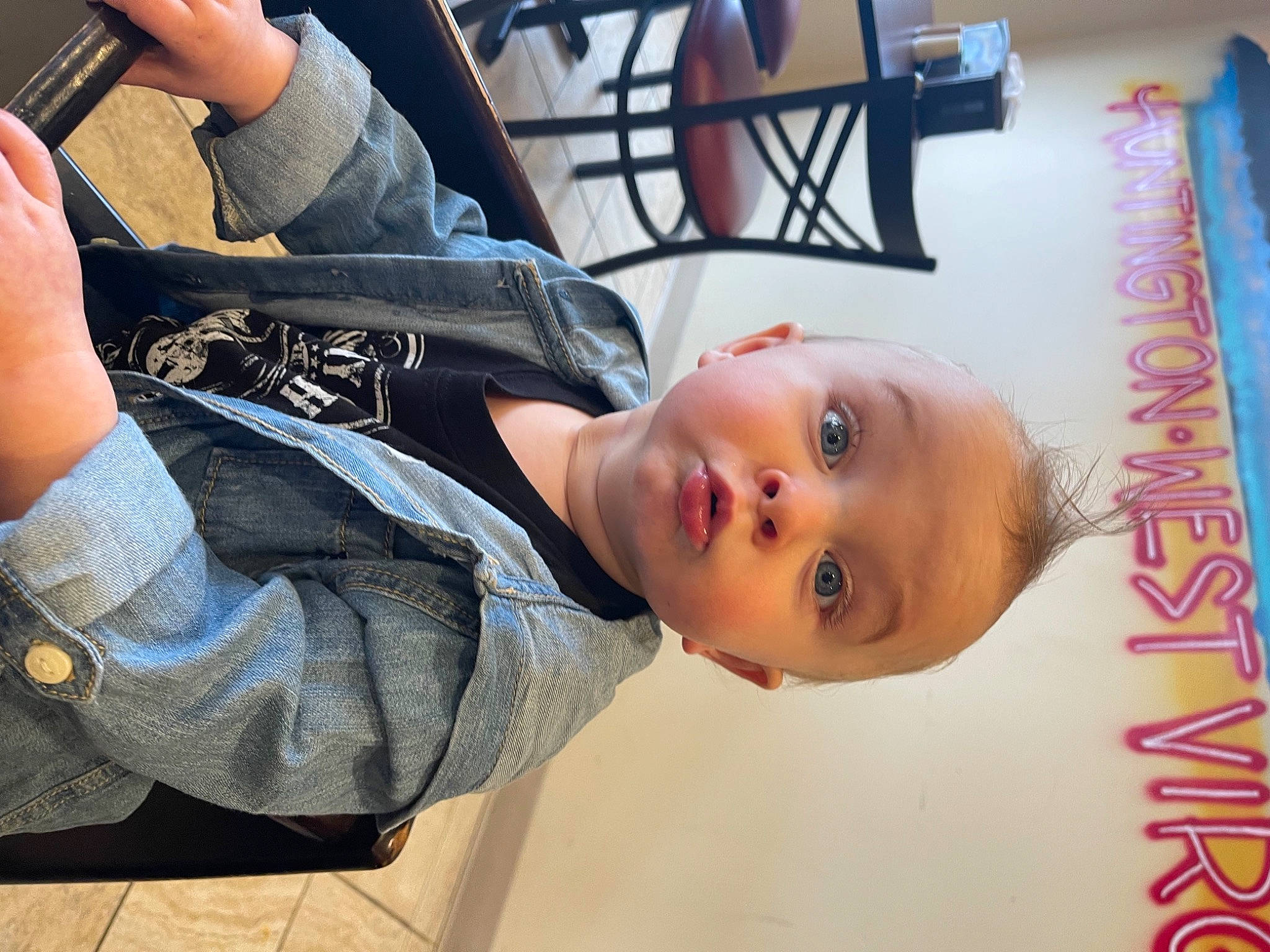 River joined the competition — help win amazing prizes! baby, child, clothing, denim, elbow, fun, gesture, leisure, person, sitting, surprise, toddler, tree, wood