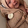 Lyssandre participe au concours pour gagner de l'argent avec cette photo : baby, blanket, brown, child, closeup, cozy, cute, ears, face, happy, hood, indoors, infant, person, portrait, skin, smiling, soft, towel, wrapped