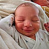 baby, newborn, smile, sleeping, blanket, infant, cute, soft, cozy, child, face, hand, clothing, rest, peaceful, indoors, portrait, relax, skin, expression