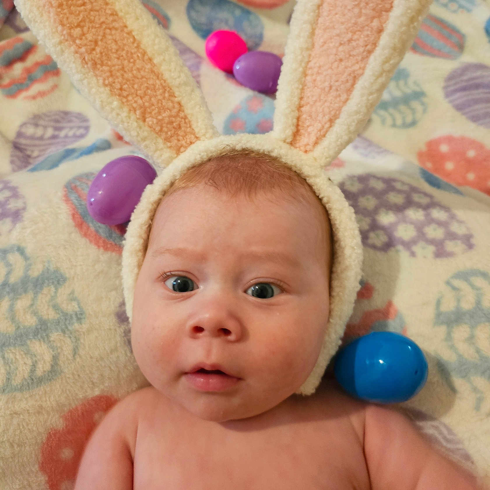 August joined the competition — help win amazing prizes! accessories, baby, balloon, bed, blanket, bonnet, cap, clothing, face, furniture, hat, head, indoors, newborn, person, photography, portrait, purple, quilt, towel