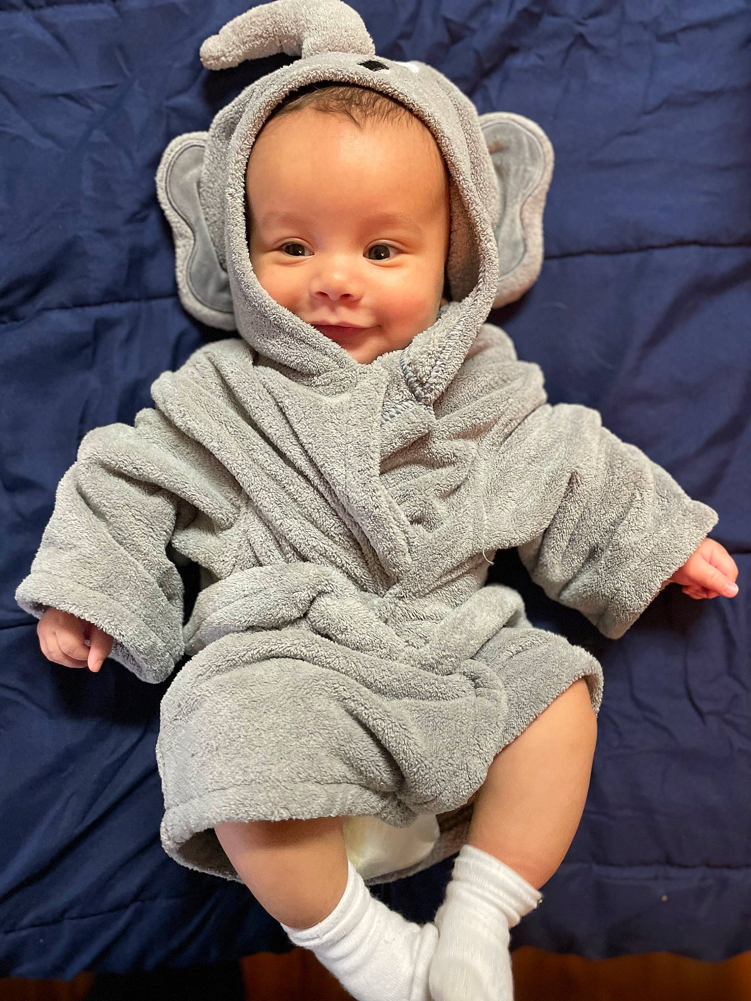 Jaxon is registered to the contest to win money with this photo: baby, baby_sleeping, baby_toddler_clothing, cap, cheek, child, comfort, eye, fur, gesture, headgear, human_leg, knee, linens, person, skin, sleeve, smile, toddler, white