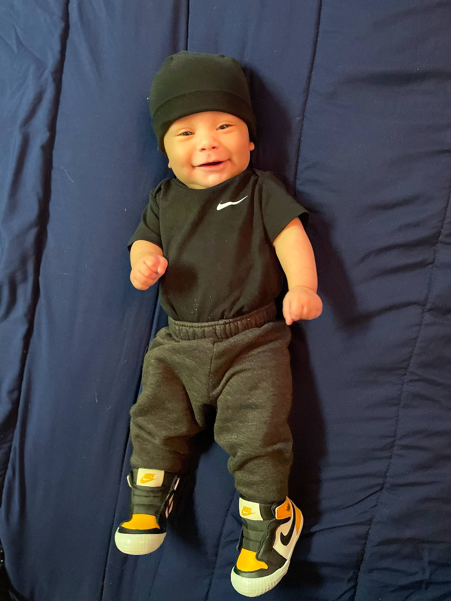 Jaxon is registered to the contest to win money with this photo: baby, baby_toddler_clothing, child, comfort, denim, electric_blue, finger, fun, gesture, hat, headwear, human_leg, joy, knee, person, personal_protective_equipment, pocket, product, sleeve, t_shirt