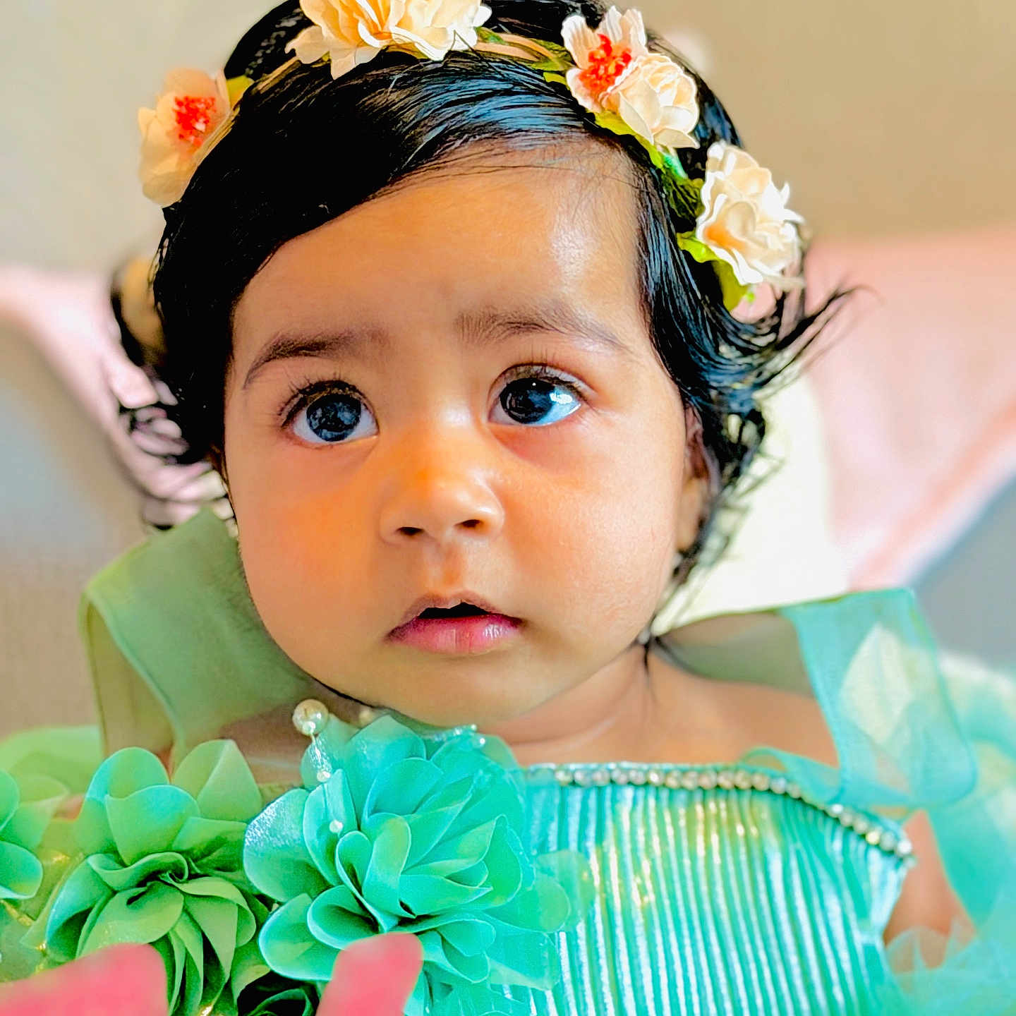 Jind is registered to the contest to win money with this photo: adorable, baby, big_eyes, blue_dress, celebration, child, close_up, curly_hair, cute, decorative_clothing, fabric_flowers, female, flower_crown, head_accessory, indoor, looking_away, pearls, portrait, soft_lighting, young_child