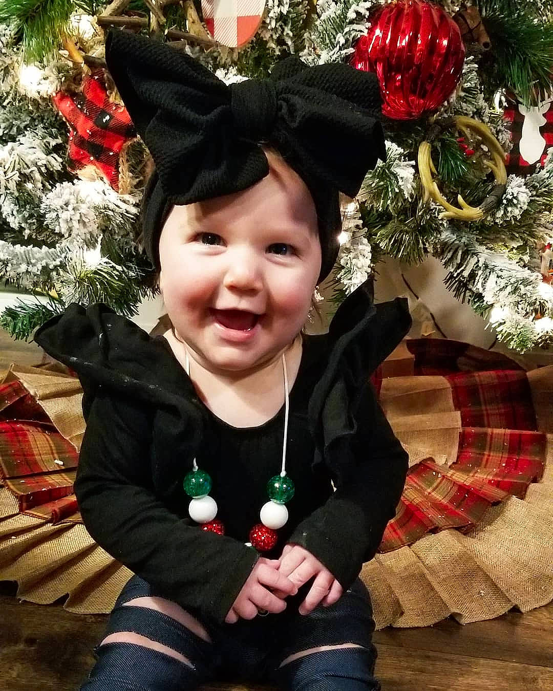 Arizona is registered to the contest to win money with this photo: child, christmas, christmas_decoration, christmas_eve, christmas_ornament, christmas_tree, ear, event, happy, headwear, holiday, interior_design, joy, person, plant, smile, toddler, tree