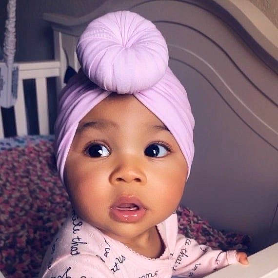 Trinity is registered to the contest to win money with this photo: baby, beauty, cheek, child, clothing, cool, ear, eye, eyebrow, face, forehead, hair, head, headgear, headwear, nose, person, pink, purple, skin