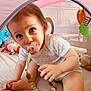 baby, bed, blue_eyes, child, closeup, crawling, curious, cute, home, indoor, infant, pacifier, person, pink, play_tent, smiling, soft_toys, toy, white_clothing, young_child