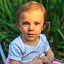 baby_clothes, blue_eyes, child, curious, cute, face, flower, grass, greenery, hands, nature, outdoor, pink_tricycle, portrait, seat, short_sleeve, summer, sunlight, toddler, young