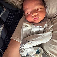 Everett joined the competition — help win amazing prizes! newborn, baby, sleeping, infant, pajamas, hand, arm, person, blanket, pillow, bed, rest, cozy, cute, indoor, child, young, sleep, comfort, soft