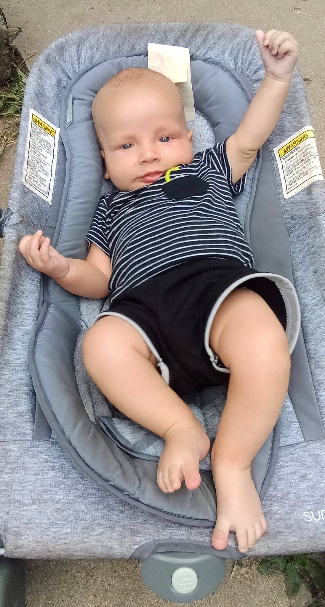 Jerry is registered to the contest to win money with this photo: baby, baby_products, baby_toddler_clothing, barefoot, chair, child, comfort, foot, human_leg, knee, lap, leg, leisure, person, photograph, shorts, sitting, skin, sock, thigh