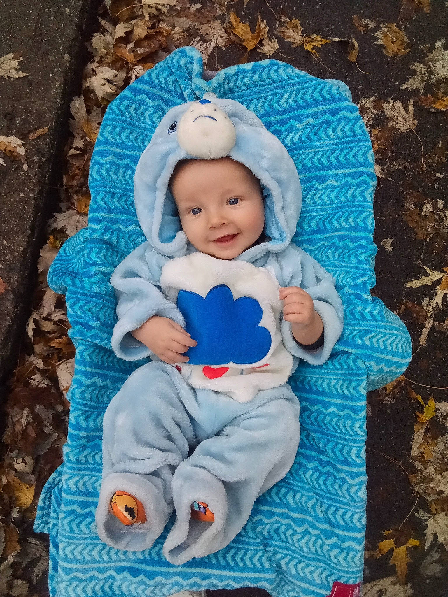 Jerry is registered to the contest to win money with this photo: azure, baby, baby_toddler_clothing, cap, child, comfort, electric_blue, eye, happy, headwear, human_body, joy, leaf, outerwear, people, person, product, sleeve, textile, toddler