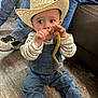 Kamdyn joined the competition — help win amazing prizes! child, toddler, cowboy_hat, denim, overalls, striped_shirt, bean, floor, indoor, jeans, sneakers, person, couch, brown_shoes, curious, sitting, cute, wide_eyes, baby, casual