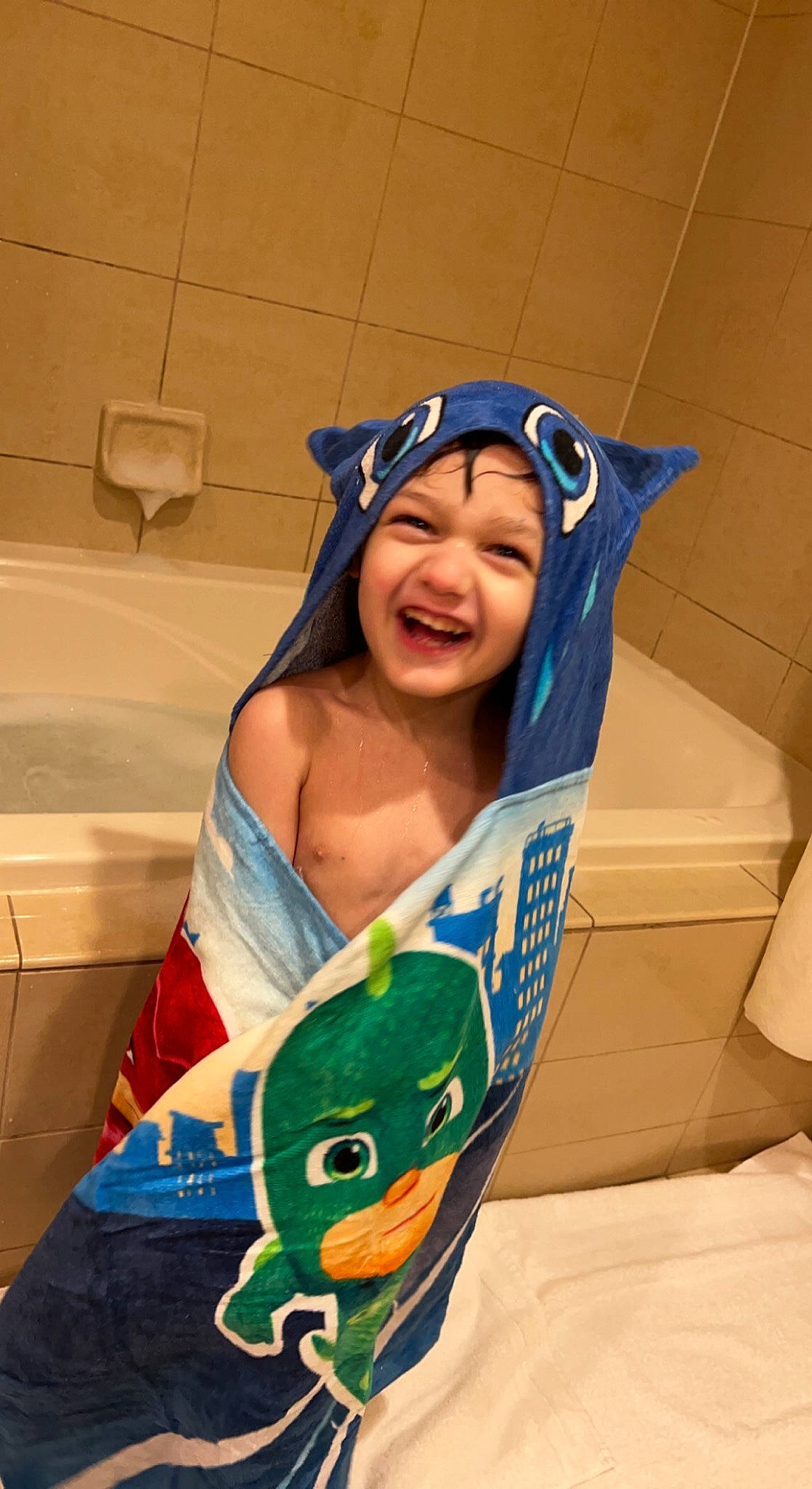 Marco is registered to the contest to win money with this photo: arm, baby, cap, child, electric_blue, eye, fun, happy, hat, head, headwear, human_body, leisure, person, personal_protective_equipment, sitting, smile, swimwear, t_shirt, thigh