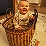 baby, basket, bed, box, clothing, crib, face, footwear, furniture, hardwood, head, infantbed, pants, person, photography, portrait, shoe, shoppingbasket, sitting, wood