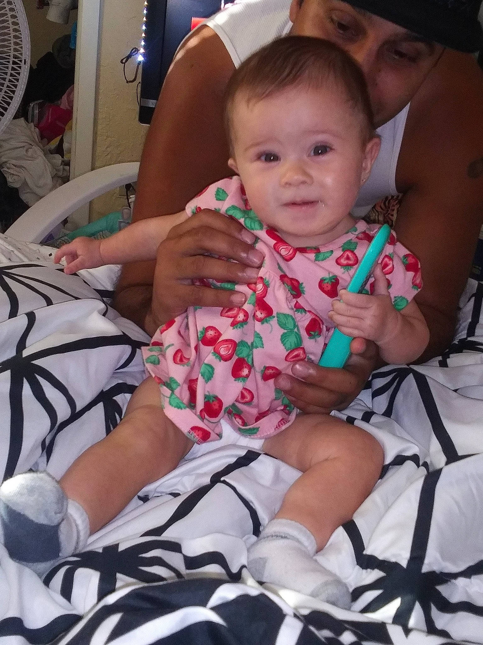 Emerald joined the competition — help win amazing prizes! baby, baby_products, baby_toddler_clothing, black, chair, cheek, child, comfort, event, fun, happy, human_leg, lap, person, pink, sitting, skin, sock, thigh, thumb