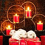 puppies, white_puppies, basket, red_basket, ribbon, red_ribbon, candles, red_candles, candle_holder, warm_light, glowing, festive, cute, animal, pet, indoor, decor, cozy, sleeping, snuggling