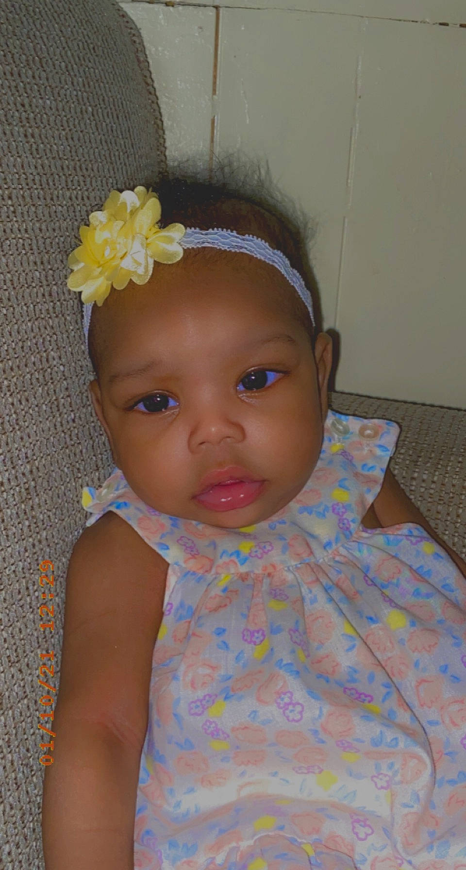 Jaiyda is registered to the contest to win money with this photo: artificial_flower, baby, baby_toddler_clothing, cheek, child, day_dress, embellishment, eye, eyelash, hair_accessory, headband, headpiece, headwear, iris, nose, peach, person, petal, skin, toddler