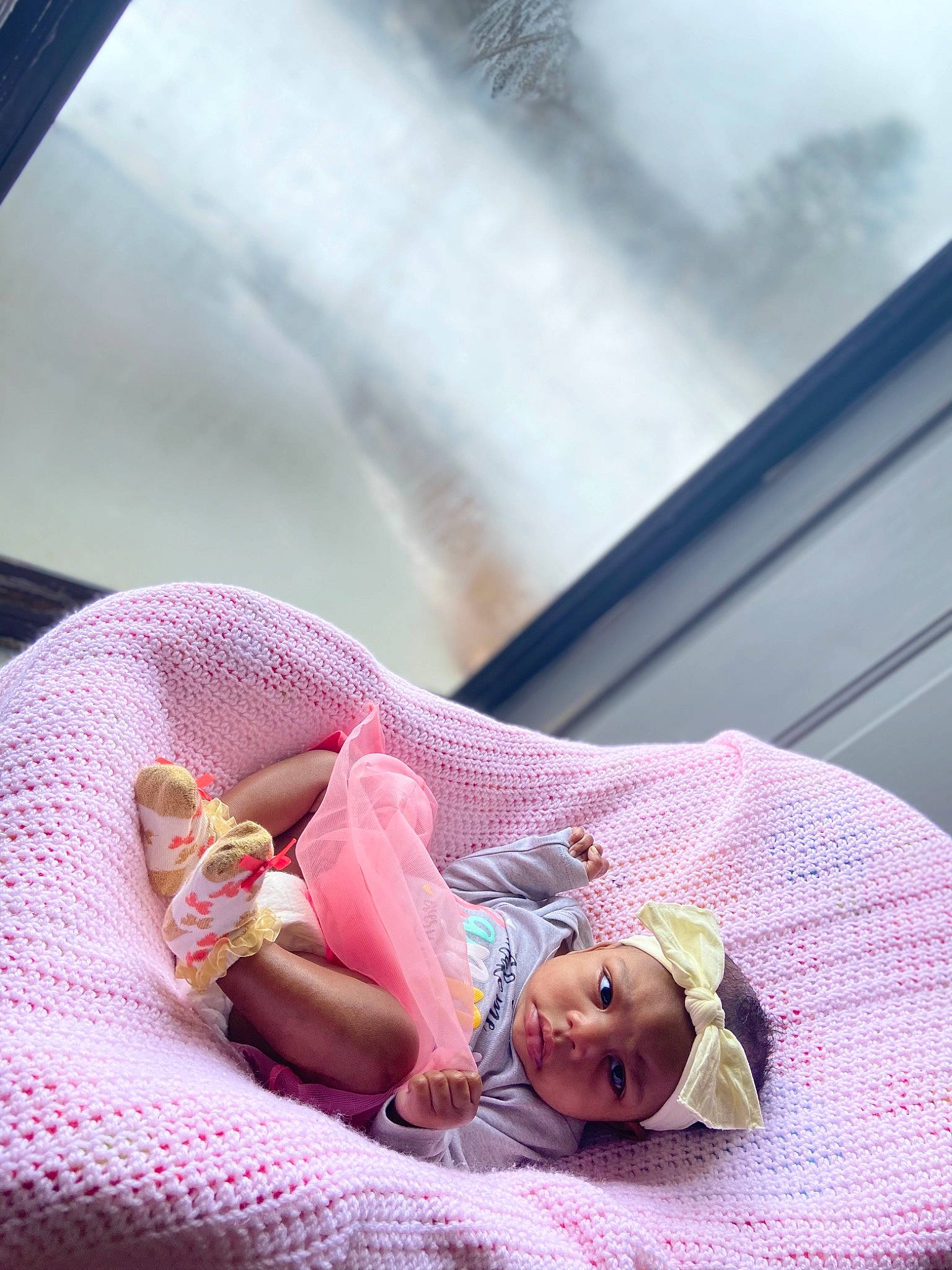 Jaiyda is registered to the contest to win money with this photo: automotive_window_part, baby, baby_products, baby_toddler_clothing, baby_toys, doll, fictional_character, foot, headwear, person, pink, toy, windshield
