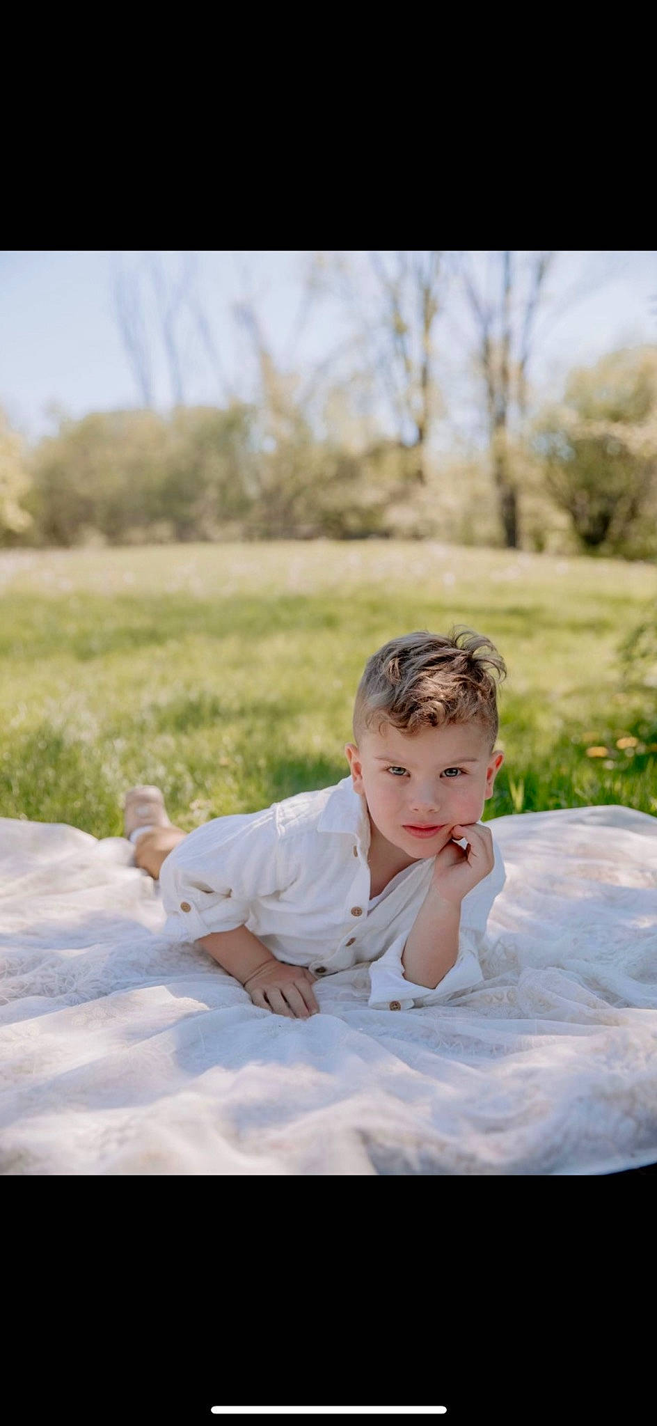 Lucca joined the competition — help win amazing prizes! bridal_clothing, child, dress, eye, flash_photography, fun, grass, grassland, happy, landscape, leisure, person, plant, portrait, portrait_photography, prairie, sitting, sky, toddler, tree