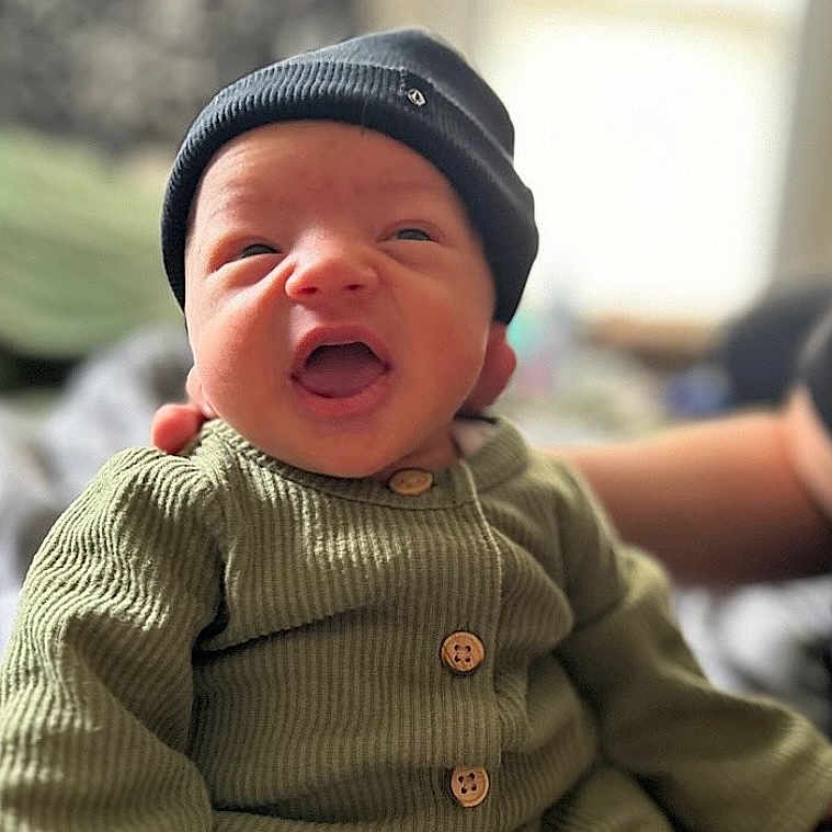 Pudge joined the competition — help win amazing prizes! baby, babylaughing, beanie, bonnet, cap, clothing, coat, face, happy, hat, head, jacket, knitwear, laughing, newborn, person, photography, portrait, sweater, yawning