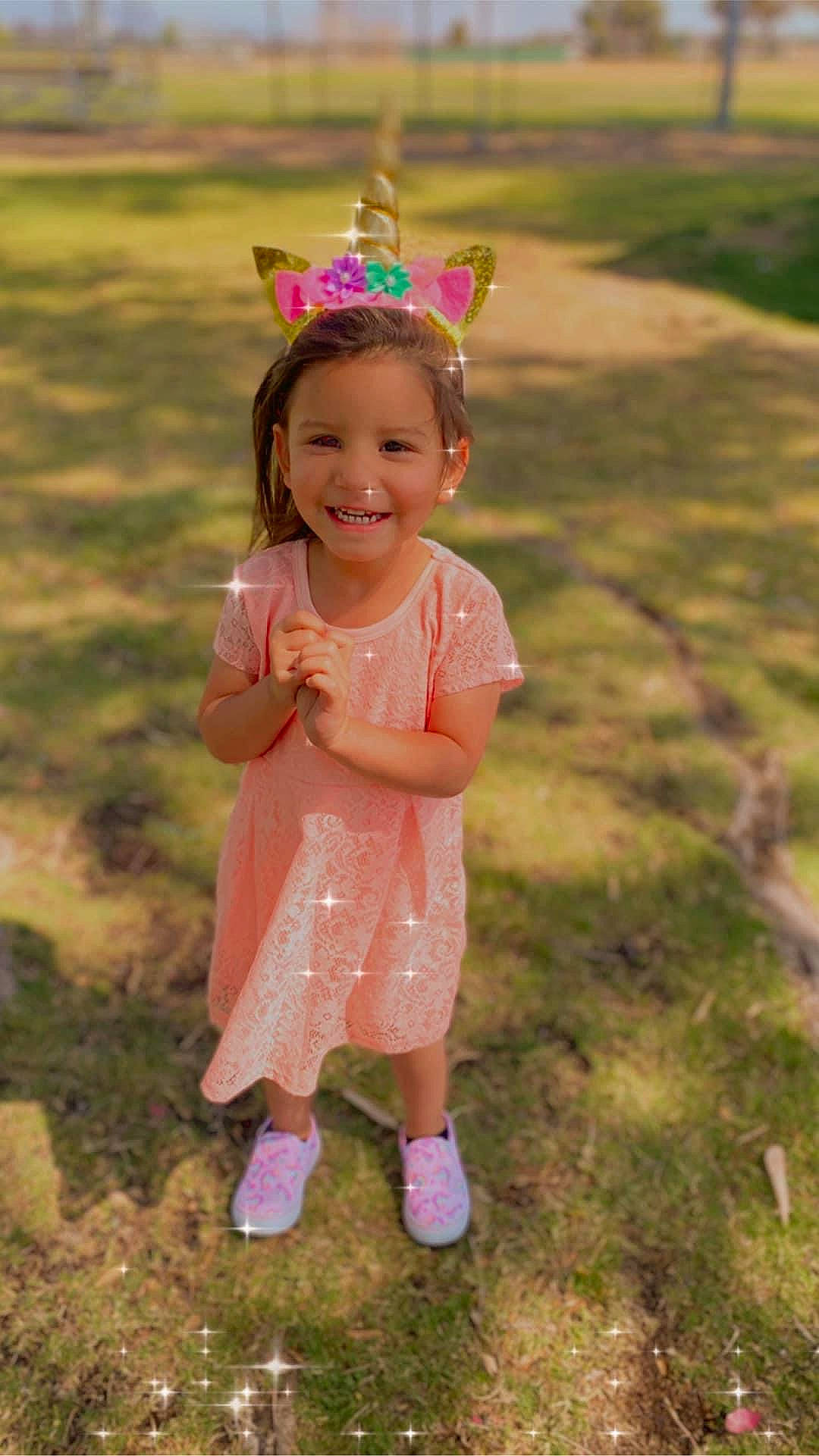 Adriana joined the competition — help win amazing prizes! baby_toddler_clothing, child, dress, eye, fun, grass, grass_family, grassland, happy, head, headgear, headpiece, joy, magenta, meadow, people_in_nature, person, pink, smile, standing