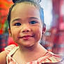 Alani joined the competition — help win amazing prizes! child, toddler, smile, face, portrait, dress, bow, striped_clothing, cute, happy, indoors, colorful_background, person, young_child, skin, hair, cheeks, eyes, fashion, cute_outfit