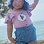 Alani is registered to the contest to win money with this photo: child, girl, smiling, hat, rope, outdoor, nature, water, shorts, sandals, grass, tree, sunny, playful, summer, portrait, happy, standing, butterfly, clothing
