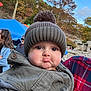 Gabriel joined the competition — help win amazing prizes! baby, child, pout, hat, pom_pom, coat, autumn, outdoor, fall_foliage, trees, blue_sky, person, face, expression, cute, warm_clothing, nature, people, holding, seasonal