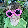 toddler, child, sunglasses, pink, green_clothing, outdoor, grass, playground, play_structure, summer, cute, person, smile, hair, pigtails, face, fashion, accessory, daylight, nature